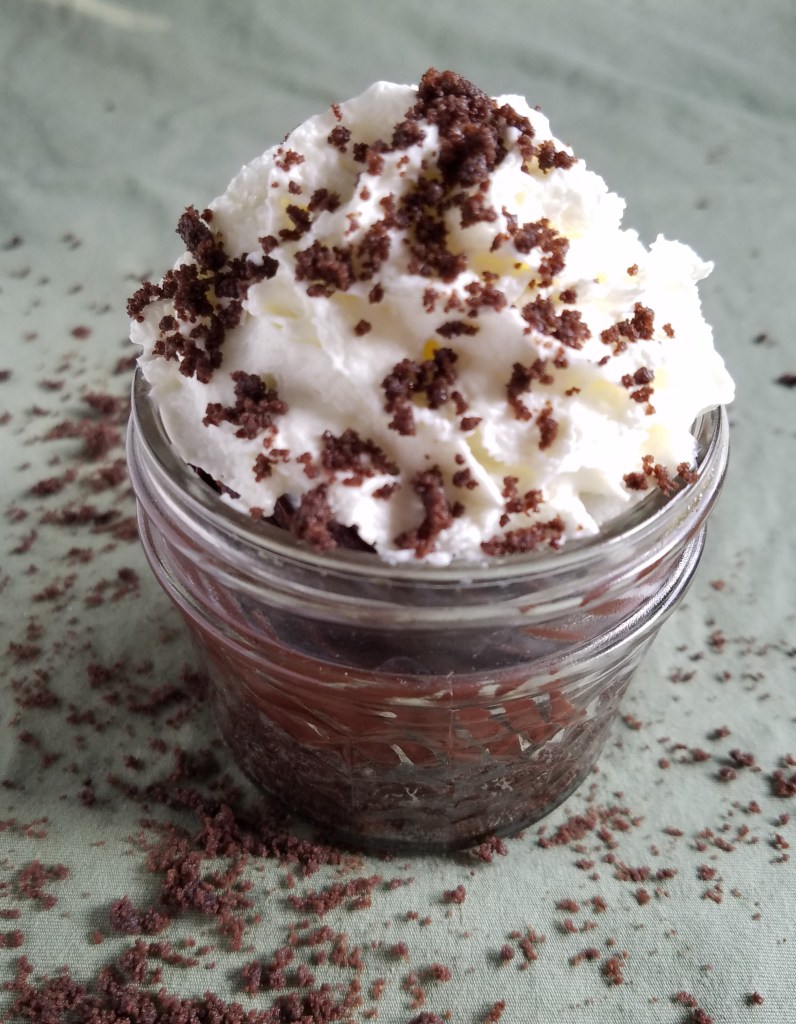 chocolate truffle cups topped with whipped cream