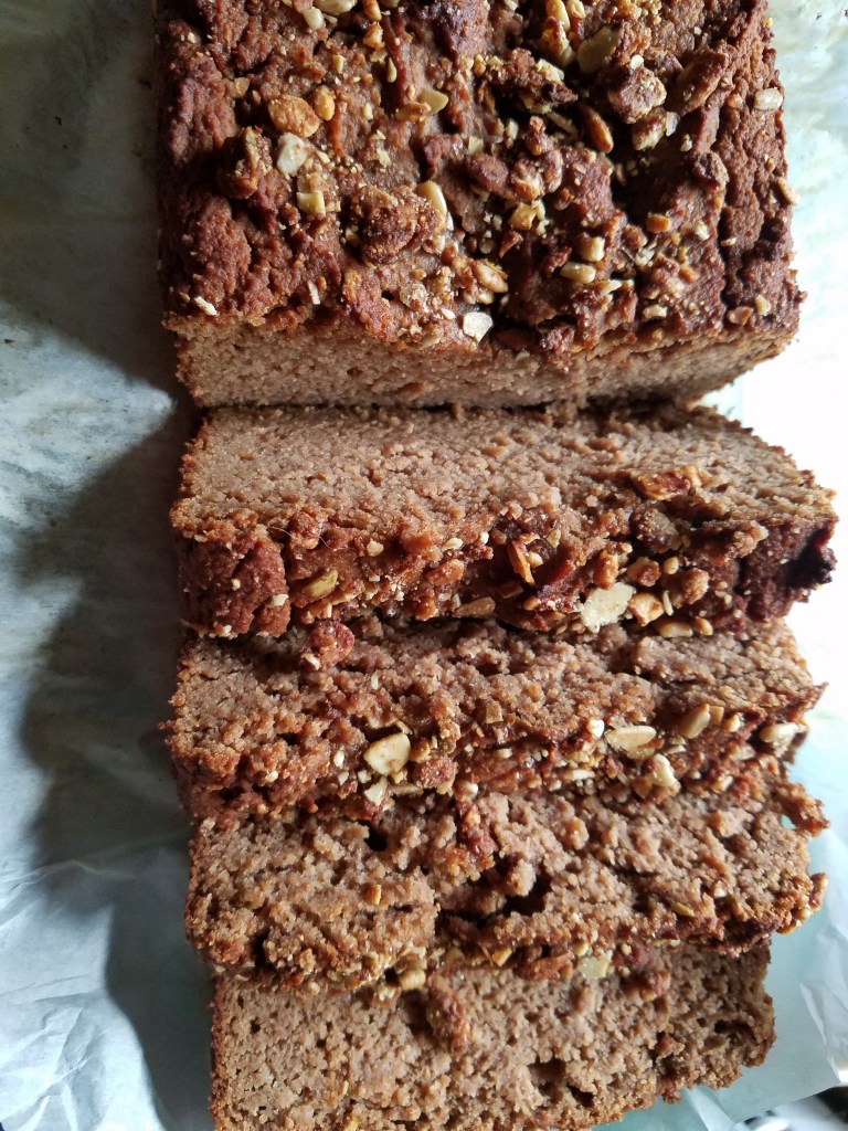 keto applesauce bread sliced on a tray.