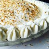keto coconut cream pie with piped edges.