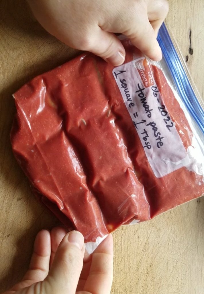 tomato paste in a freezer bag with score marks for easy portioning