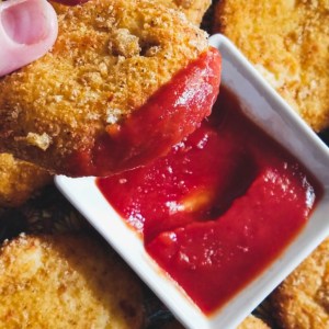 keto air fryer chicken nuggets on a platter with ketchup for dipping