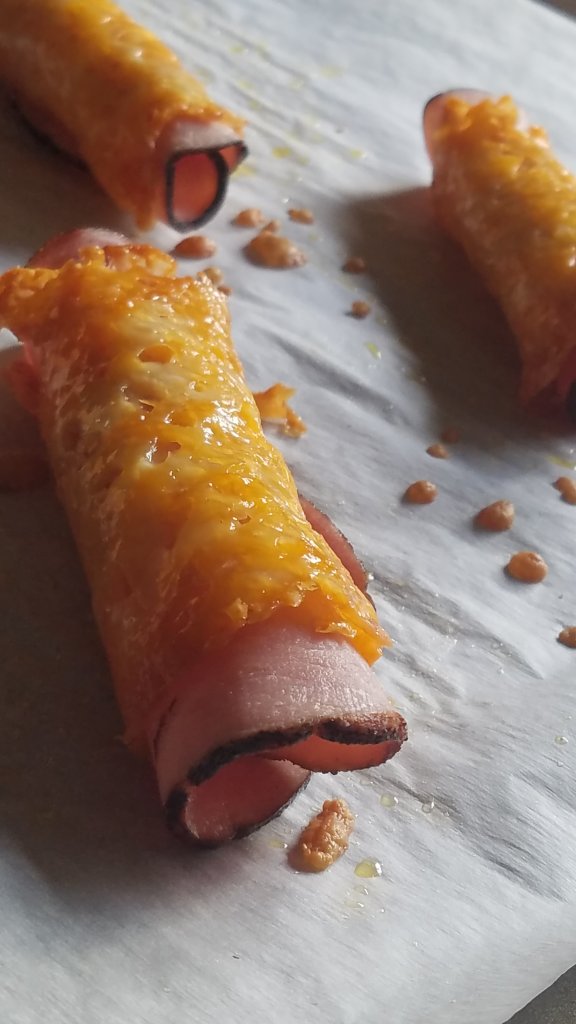 ham and cheese roll ups on a sheet pan