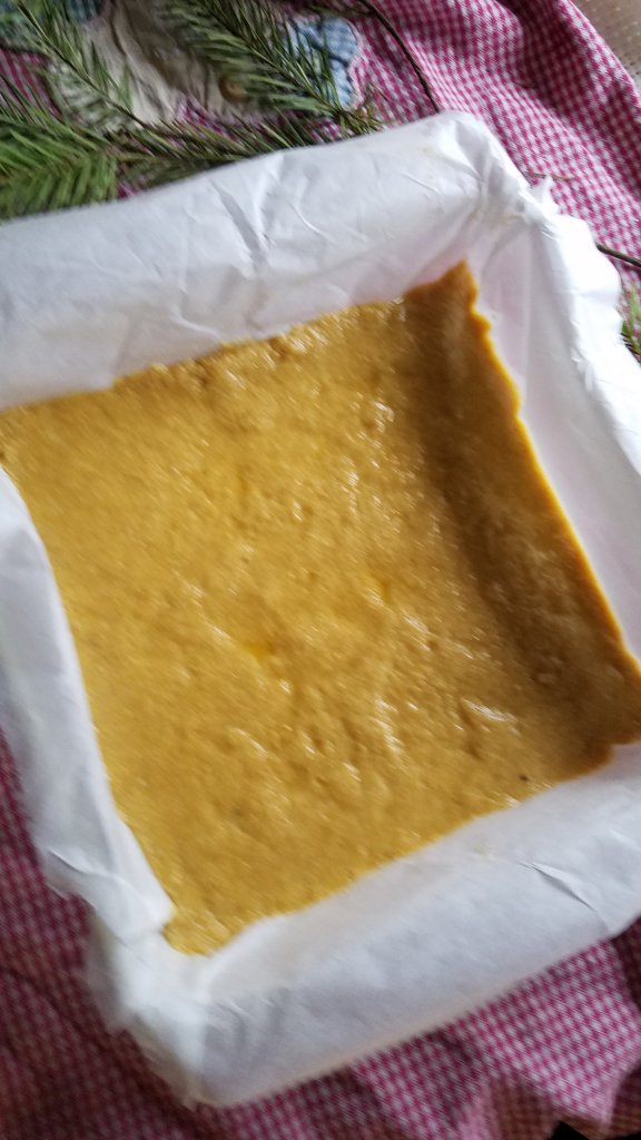 press the mixed crumb mixture into the parchment lined pan