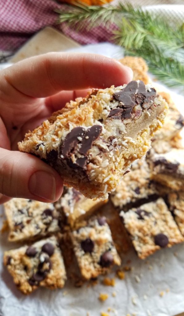 close up of a piece of seven layer magic bars