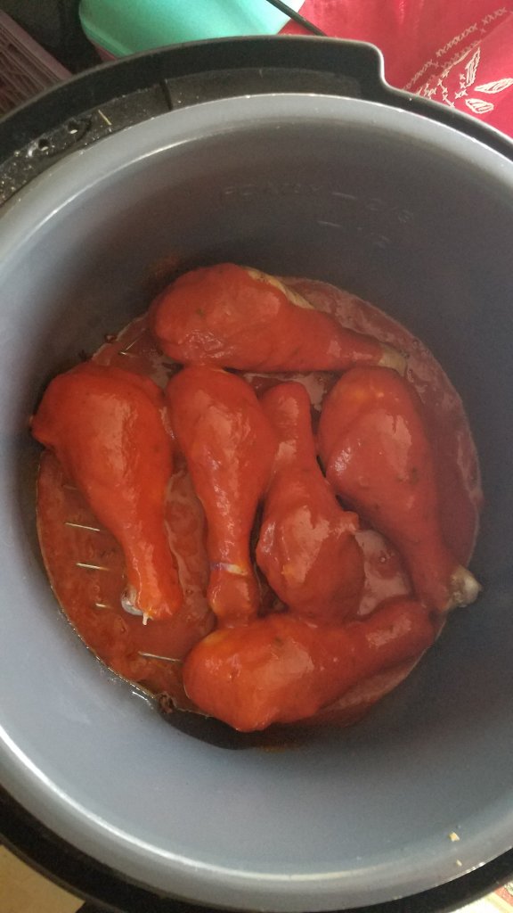 browned chicken covered with enchilada sauce