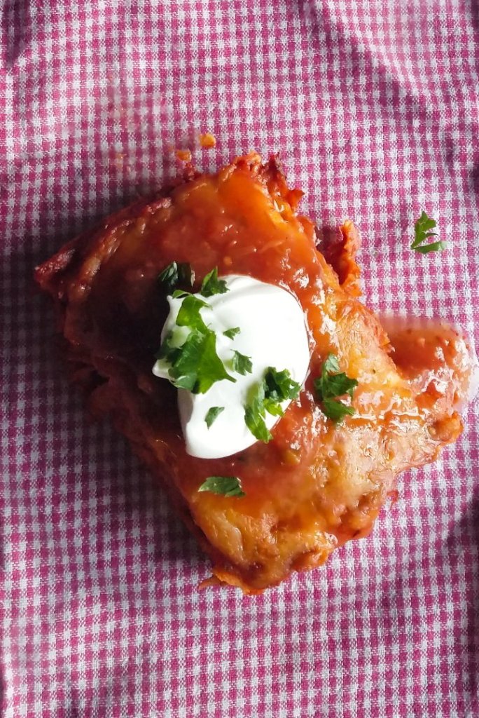 low carb mexican chicken casserole plated with sour cream and salsa