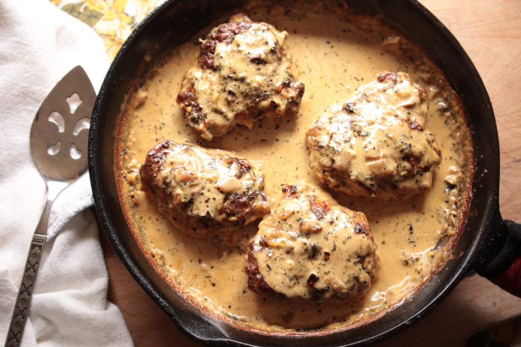Keto Italian Baked Chicken Thighs in cast iron skillet