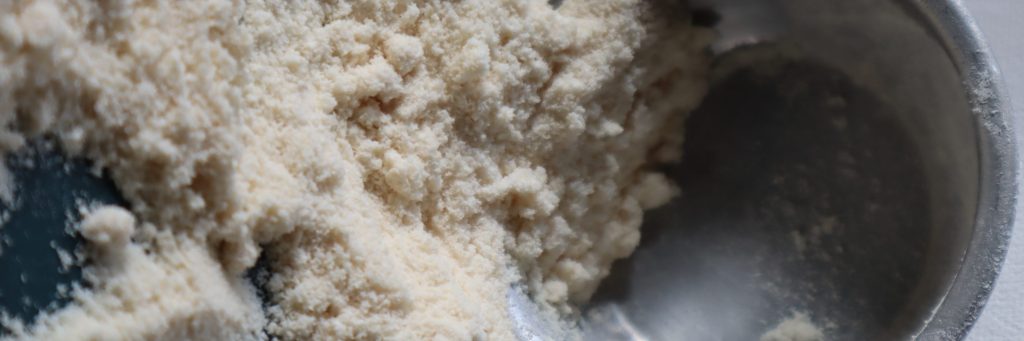 Coconut flour with metal measuring cup