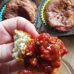 keto pizza dippers dipped into keto marinara sauce