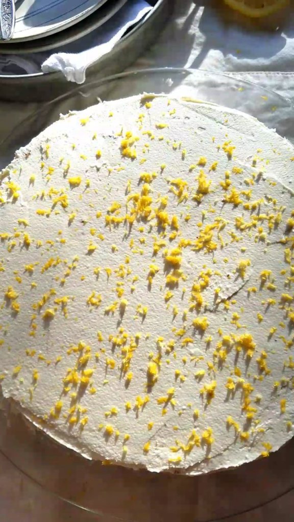 adding lemon zest to the top of the best sugar free lemon cake