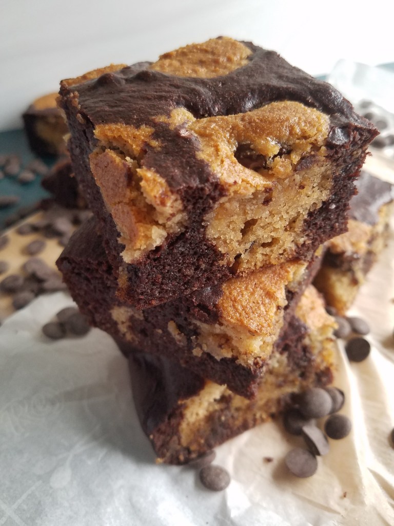 low carb brookies stacked which are brownies with blondies spotted throughout.