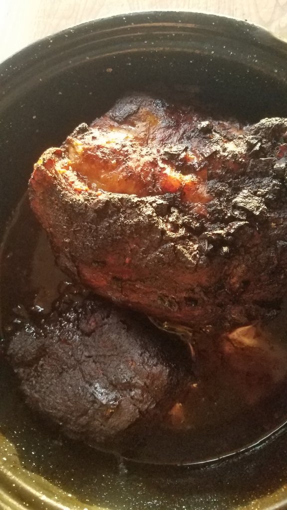 pork shoulder with a seared crust after coming out of the oven