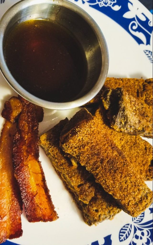 keto french toast sticks with maple dipping sauce in a small silver bowl