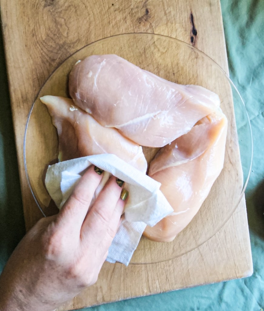 patting the chicken breasts before seasoning