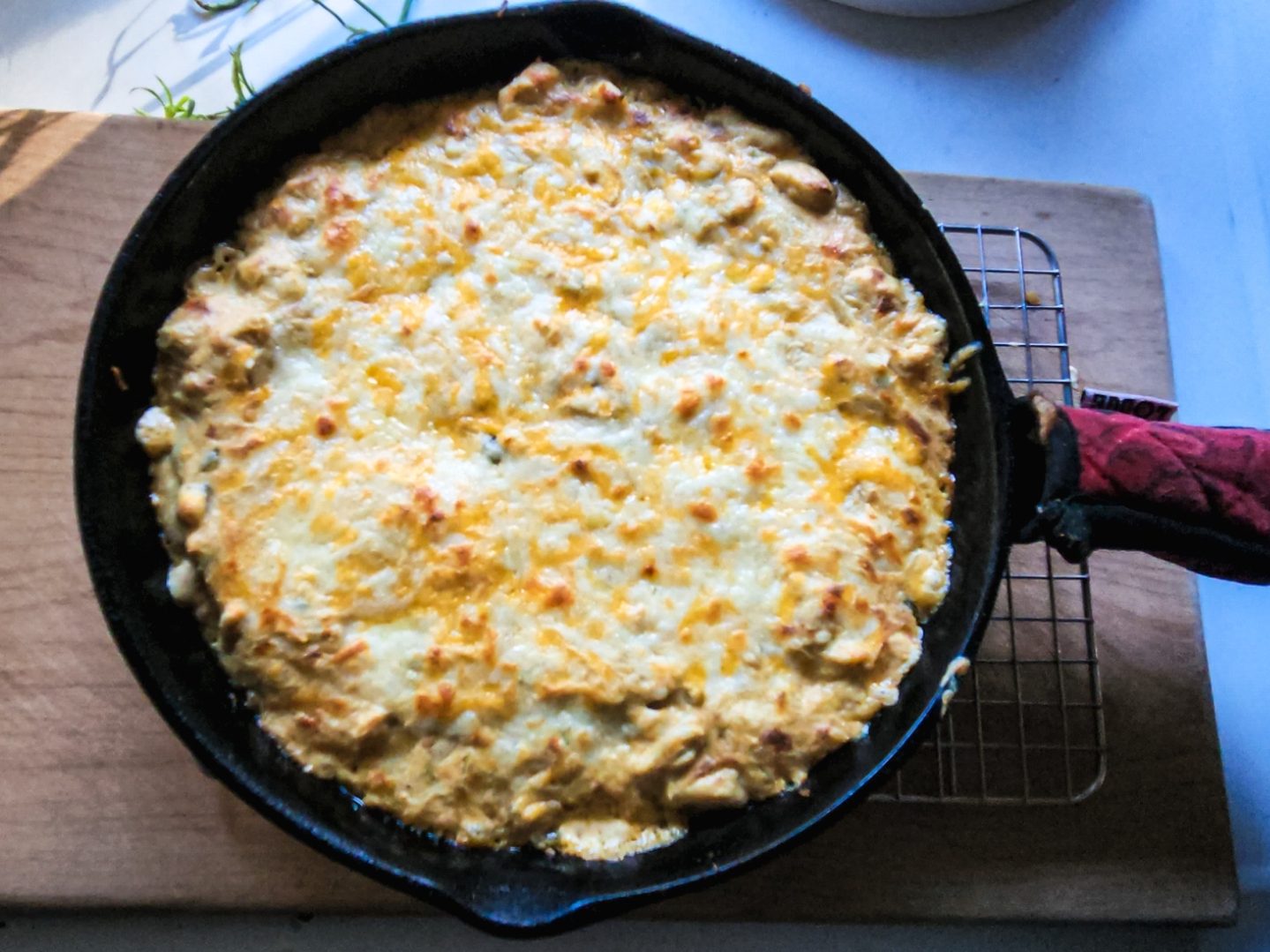 Gluten Free Cheesy Green Chile Chicken Skillet in a cast iron skillet