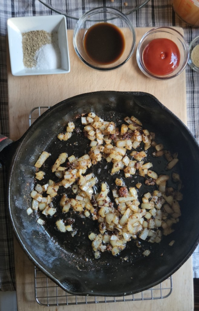 Sauteed onions and cast iron skillet for gluten-free Salisbury steak gravy