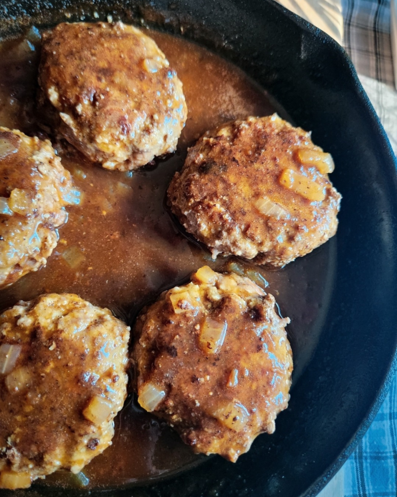 Easy Gluten Free Salisbury Steak in a cast iron skillet