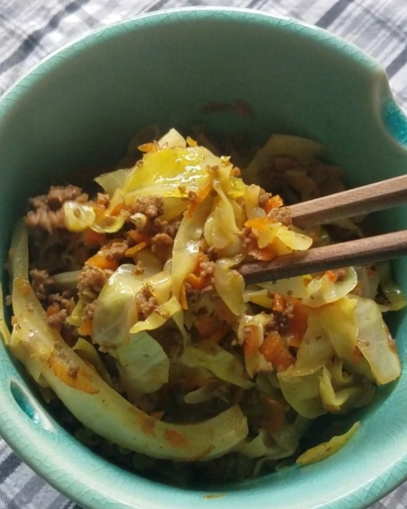 The best instant pot low carb Egg Roll in a bowl being eaten with chopsticks