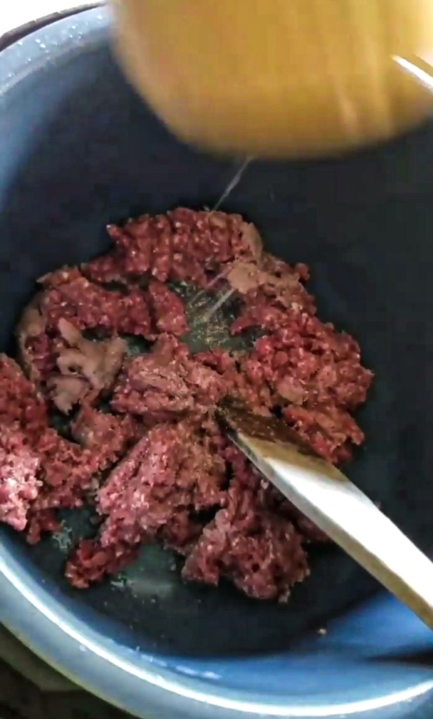 Ground meat being browned in the instant pot