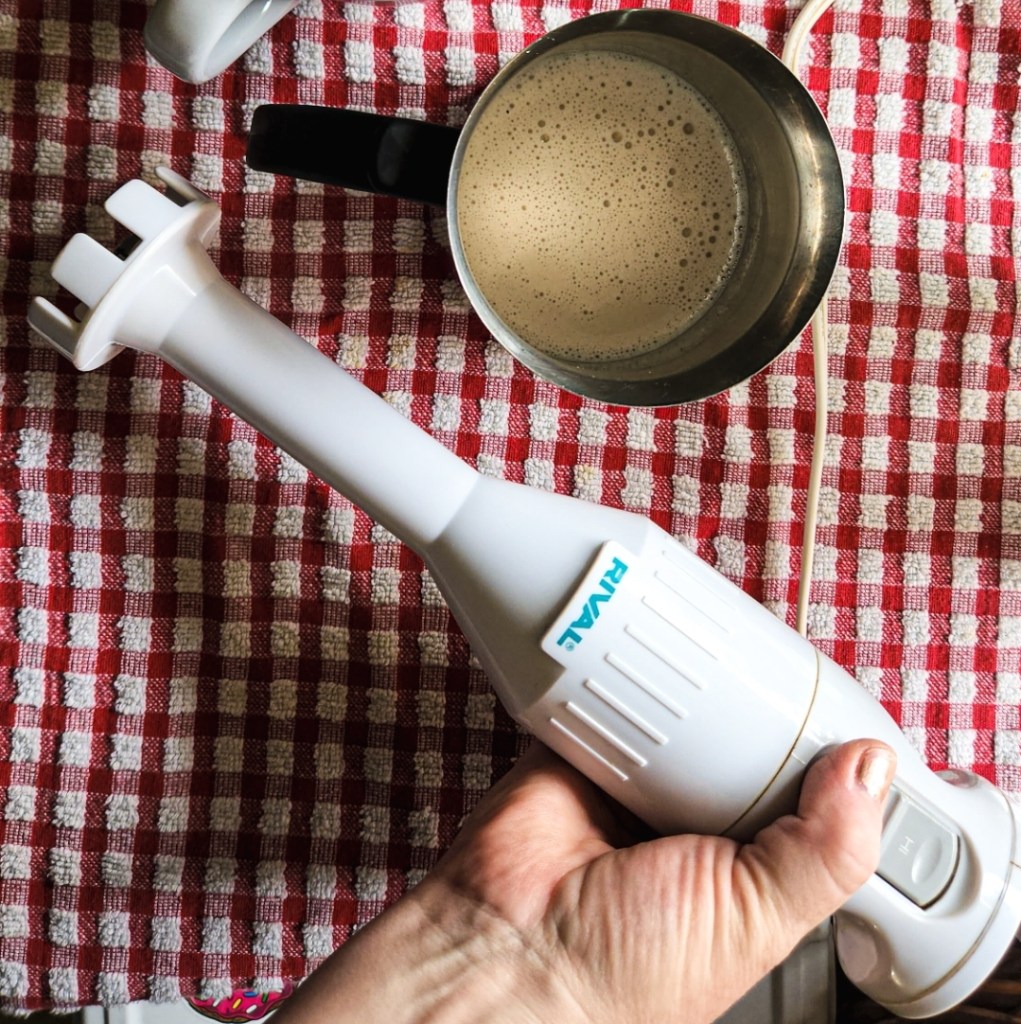 making coffee foam with an immersion blender.