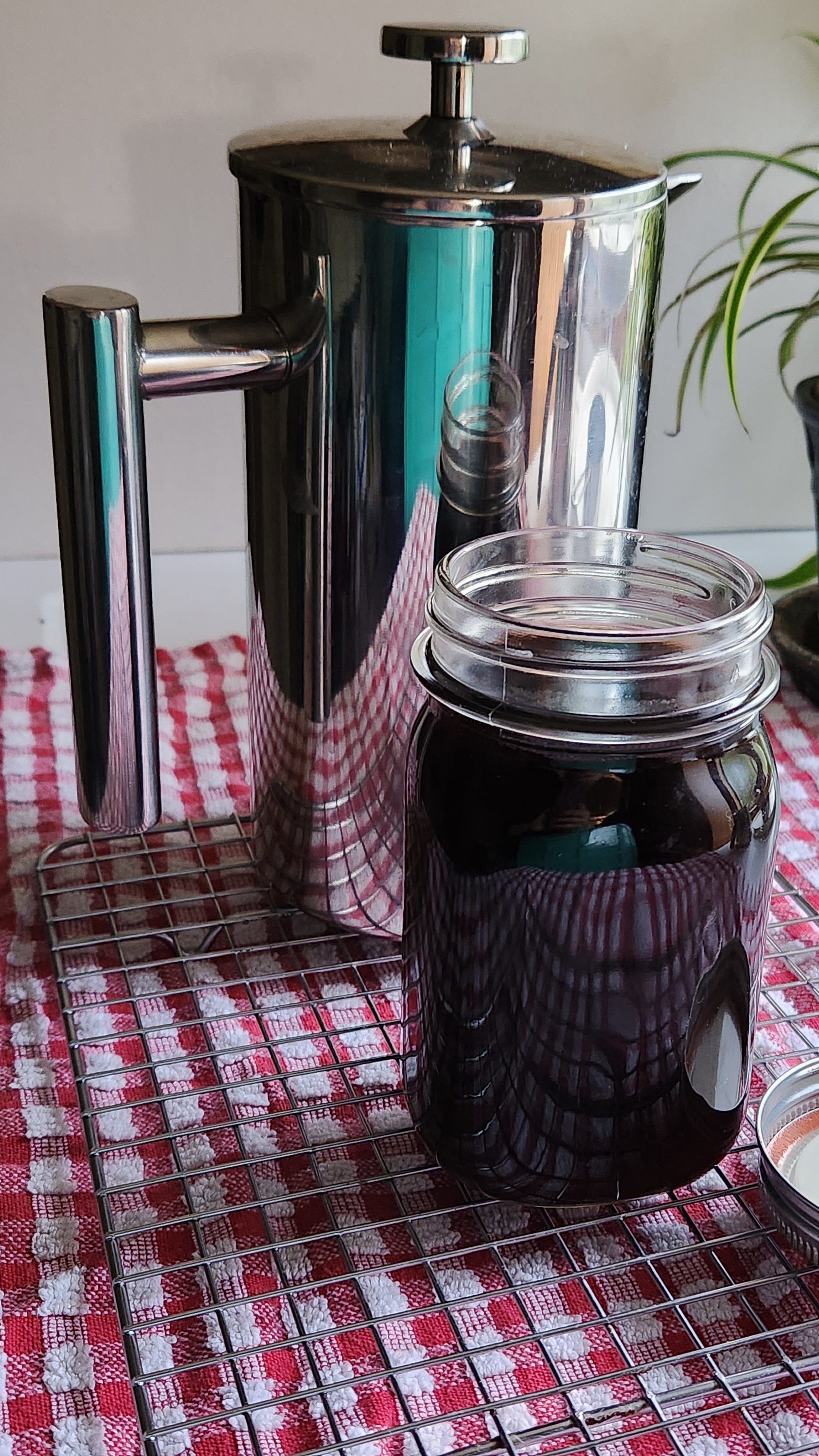 french press with coffee in a jar.