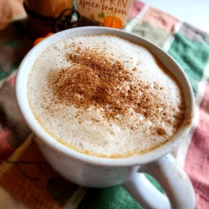 Gluten Free Starbucks Pumpkin Spice Latte in a mug with spice sprinkled on the foam