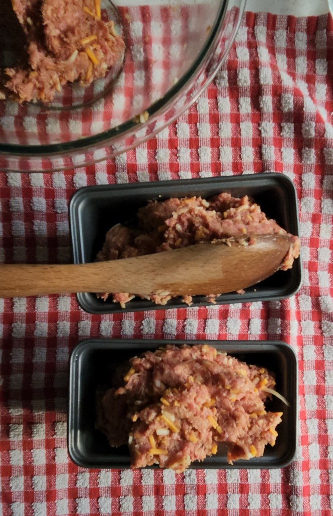 Putting meatloaf mixture into instant pot mini bread pans