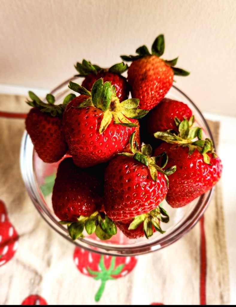 strawberries in a glass bowl.