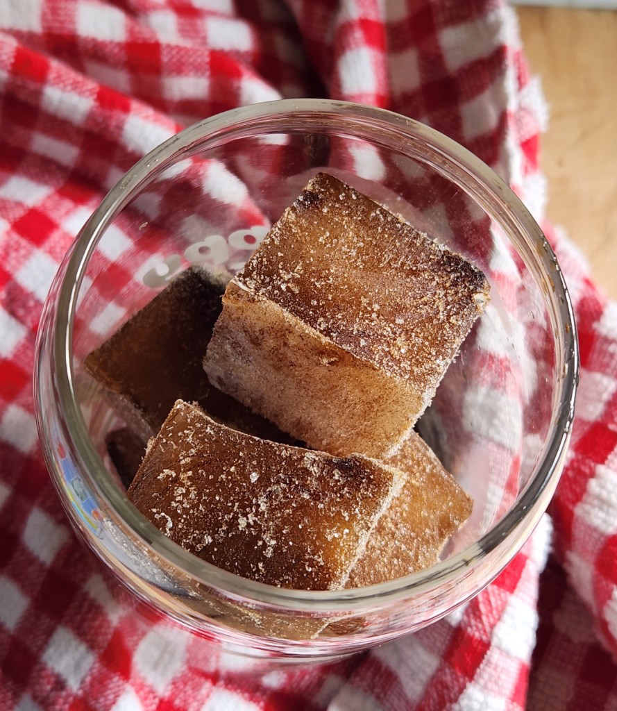 glass filled with coffee ice cubes.
