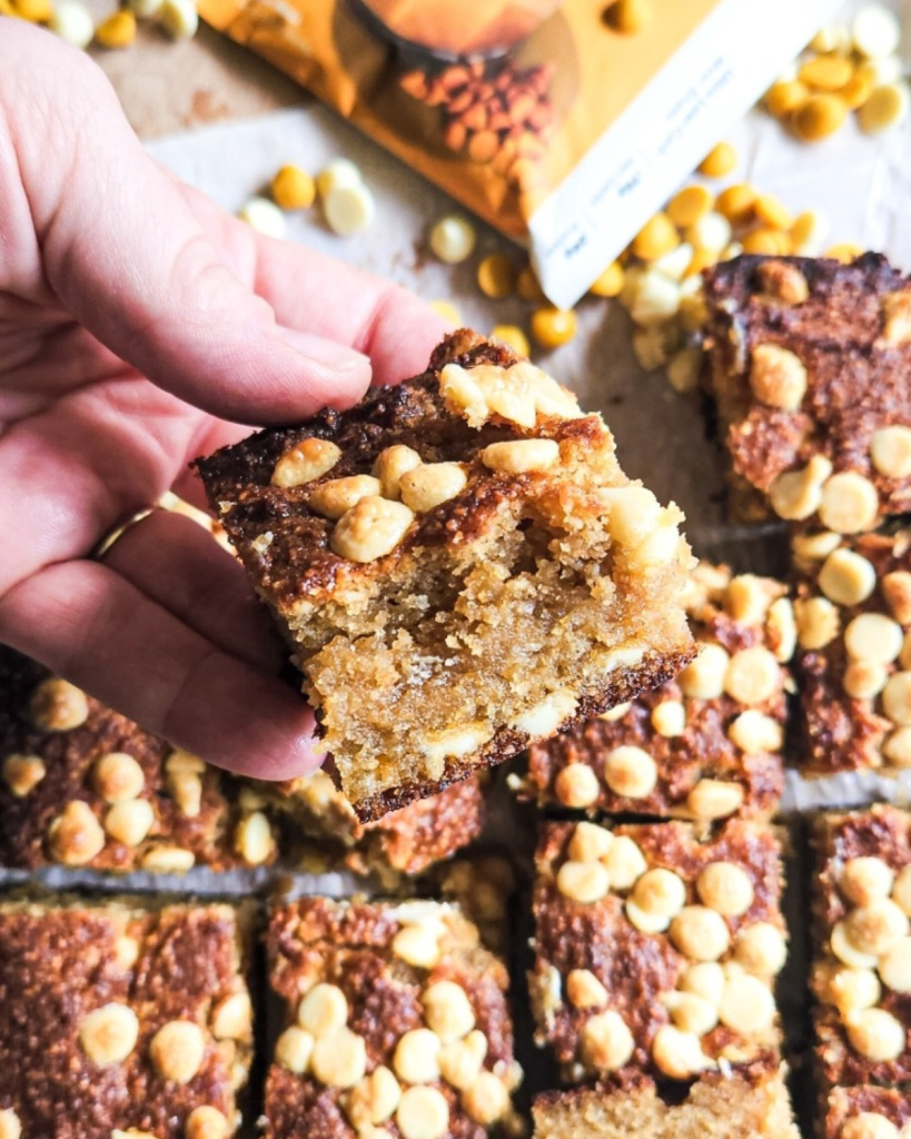 a piece of the best gluten free low carb butterscotch blondies cut to show texture.