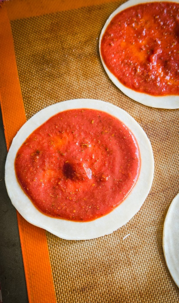 low carb pizza sauce spread onto the low carb tortilla.