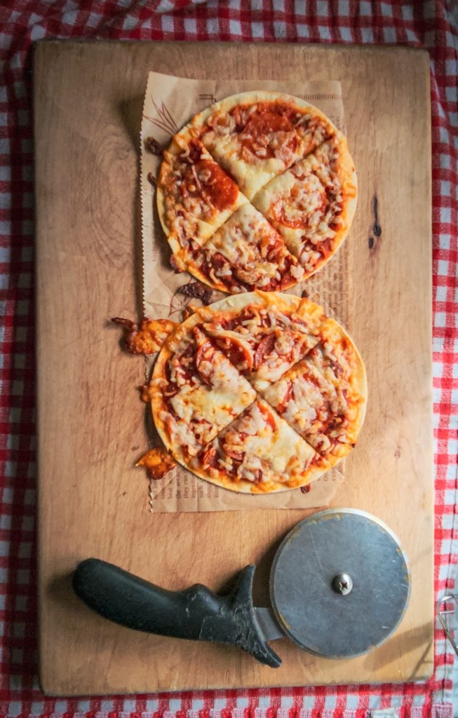 Easy gluten free low carb tortilla pizzas on a cutting board