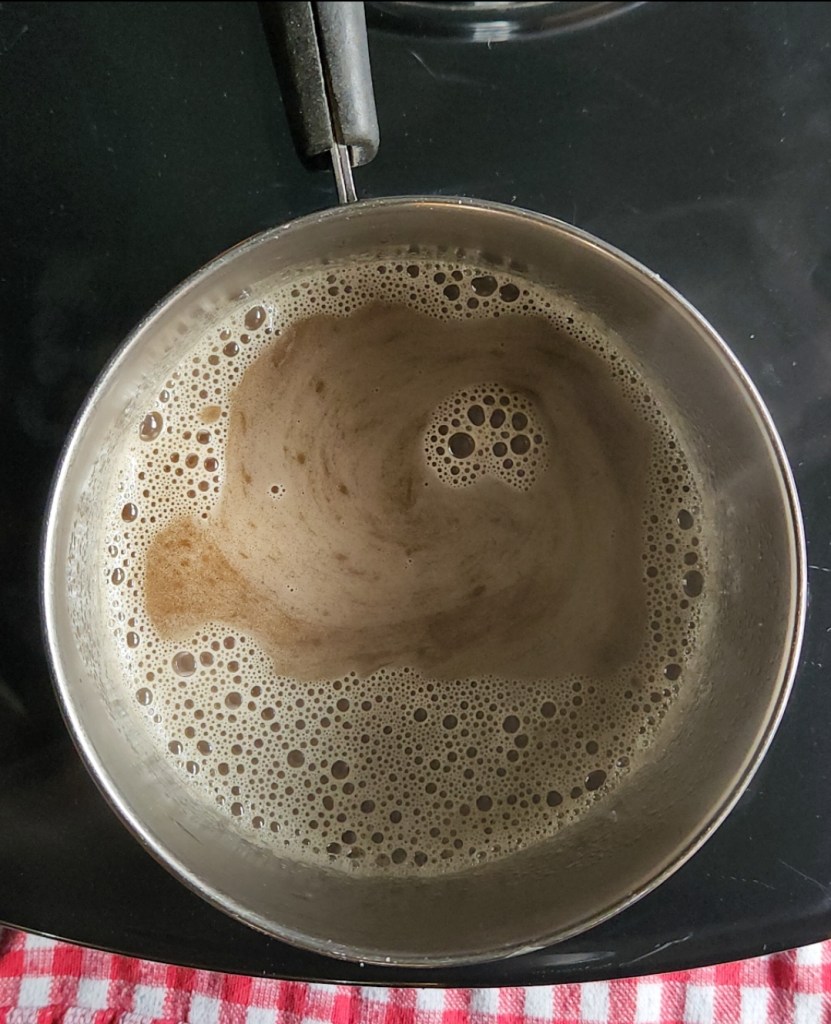 Simmering in a pan.