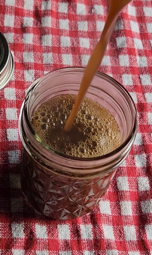 Easy keto maple syrup substitute recipe being poured into a