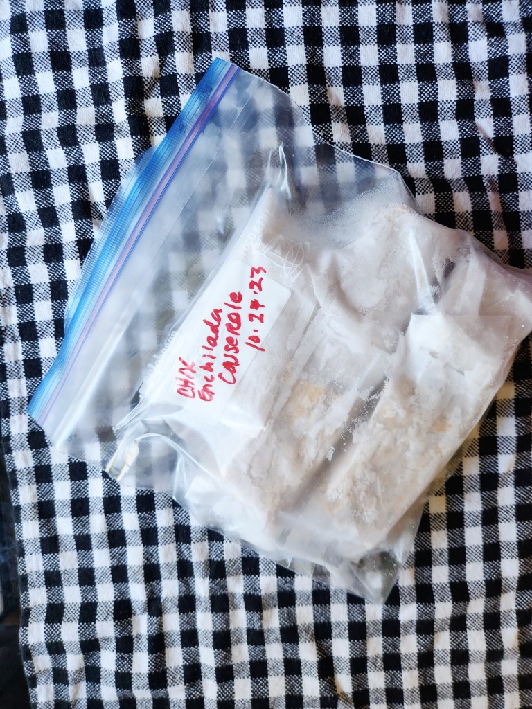 low carb mexican casserole frozen in squares and wrapped in parchment paper.