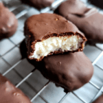 low carb homemade copycat mounds candy bar cut in half.