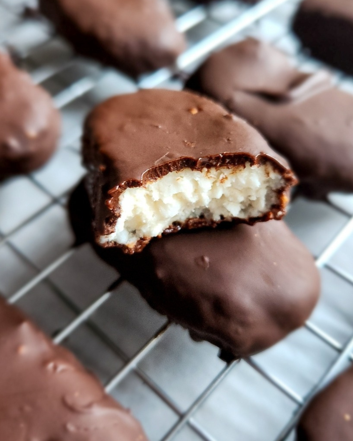 low carb homemade copycat mounds candy bar cut in half.