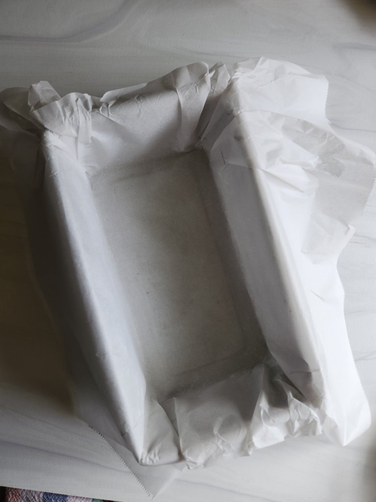 bread pan lined with parchment paper for the best gluten free low carb bread.
