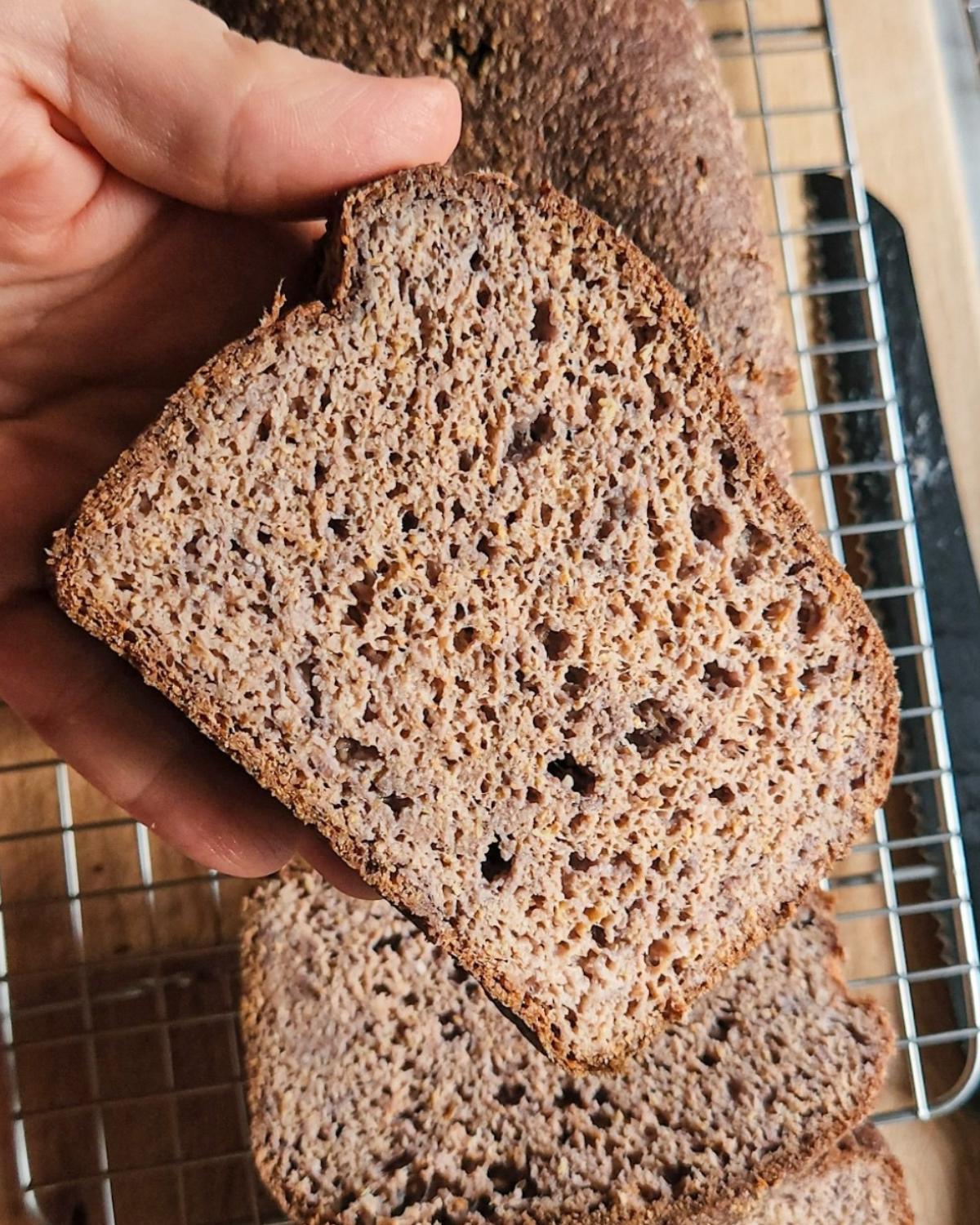 Showing a cut piece of the best gluten-free low-carb bread.