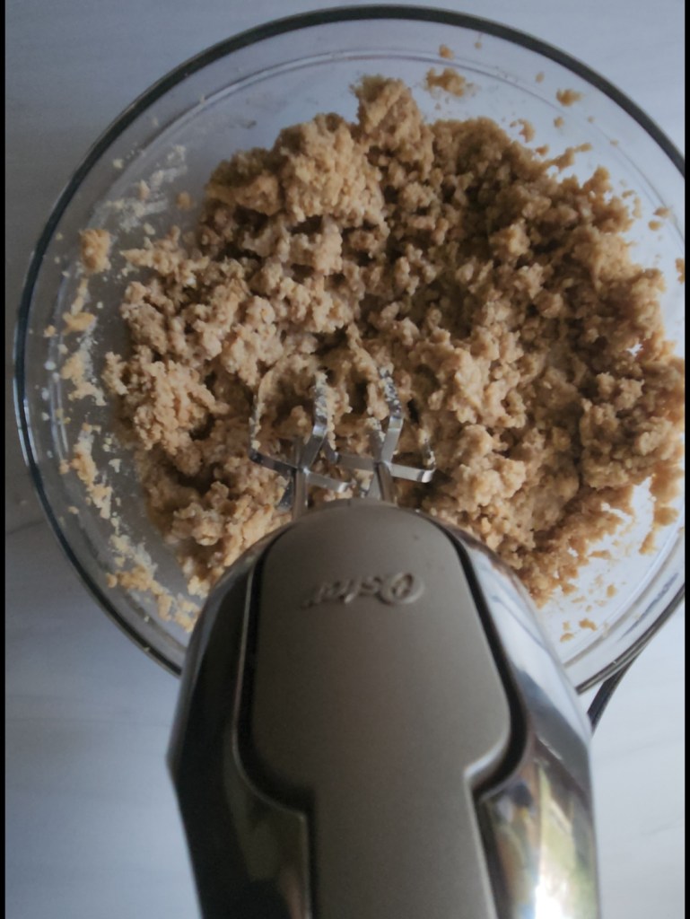 The best gluten-free low-carb bread recipe being mixed up after the eggs are added to the dry ingredients.