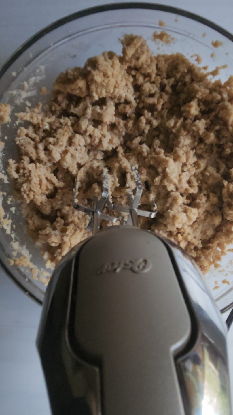 mixing wet ingredients into dry ingredients.