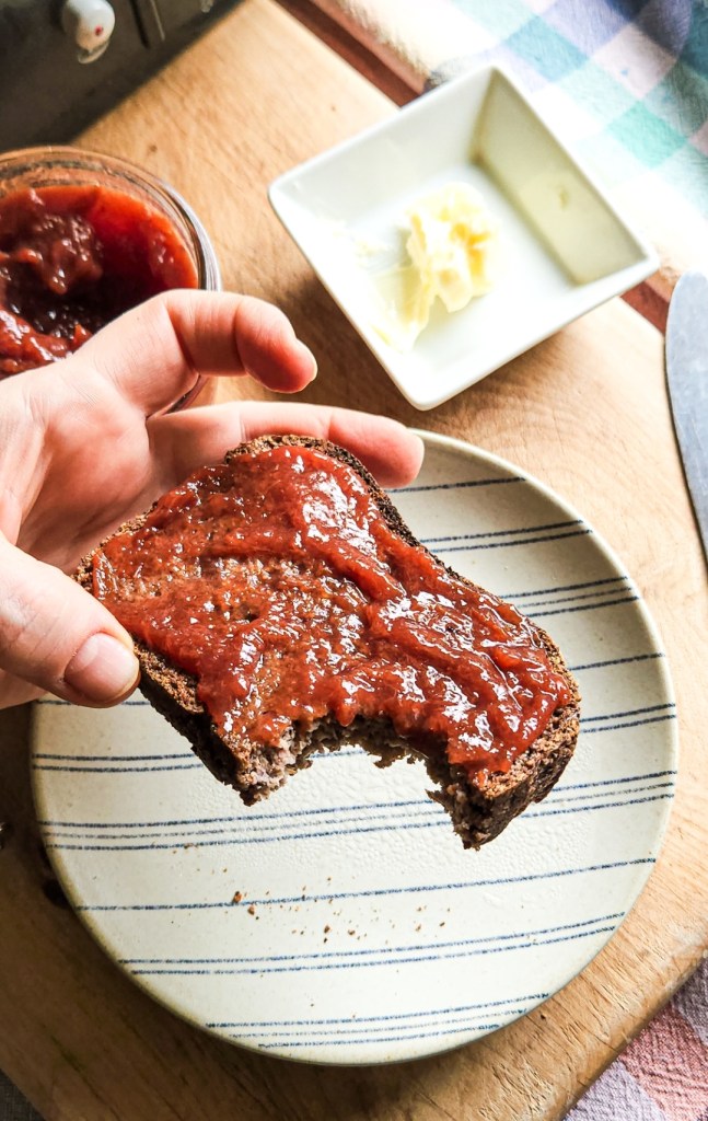toasted piece of gluten free bread with butter and jam.