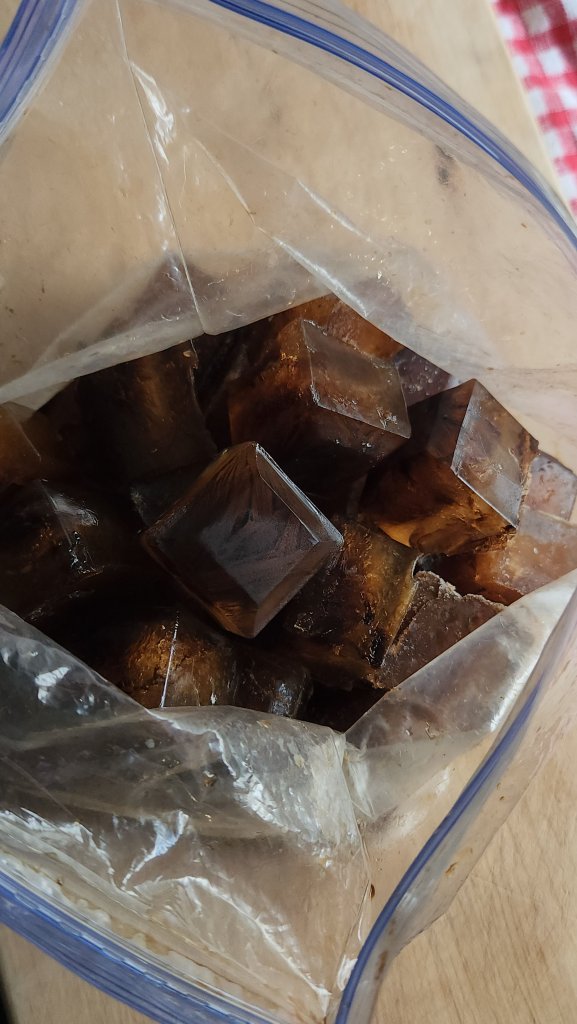 Coffee ice cubes in a large gallon freezer bag.
