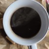 Brewed coffee in a large white mug.