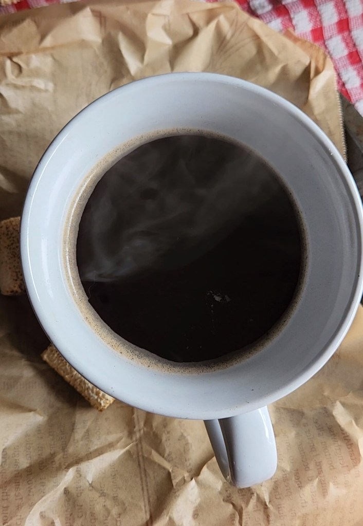 Brewed coffee in a large white mug.