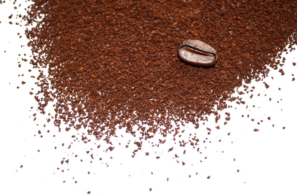 coffee ground up and spilled on a surface.