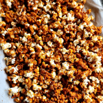 Low Carb Caramel Popcorn Recipe without Corn Syrup spread out on a pan.