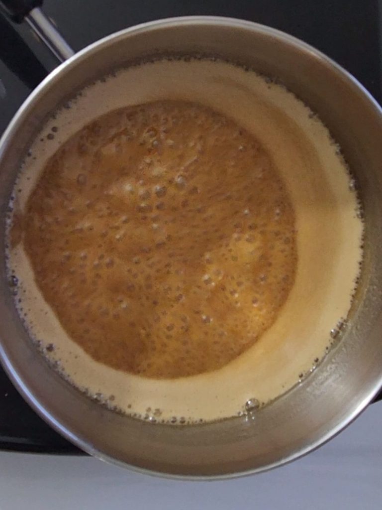 Sugar-free caramel sauce boiling before adding baking soda.