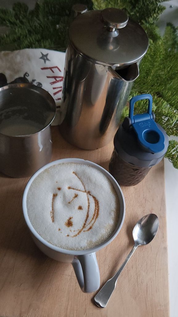 Low carb copycat Starbucks gingerbread syrup recipe made into a gingerbread latte with syrup swirl on top.