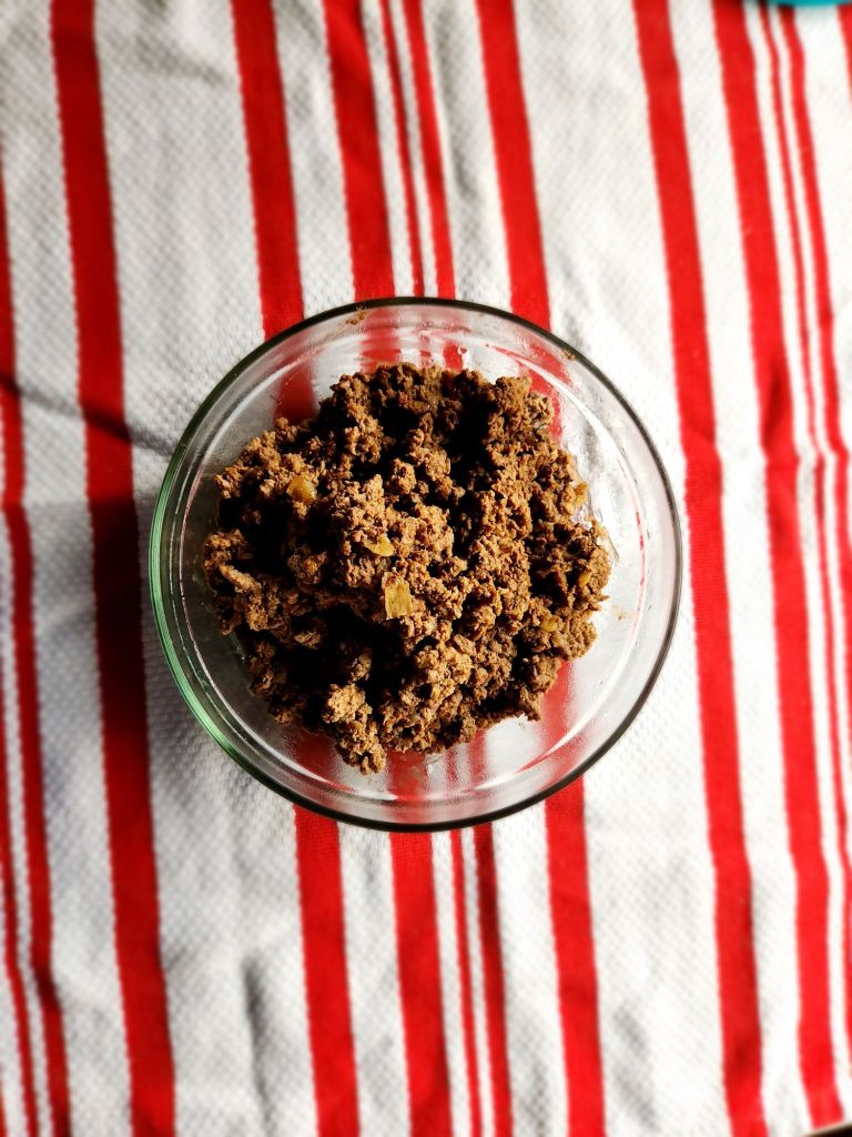 leftover taco meat in a glass bowl.